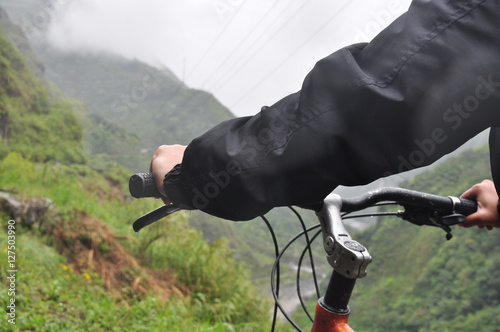 Man riding bicycle at Banos, Ecuador