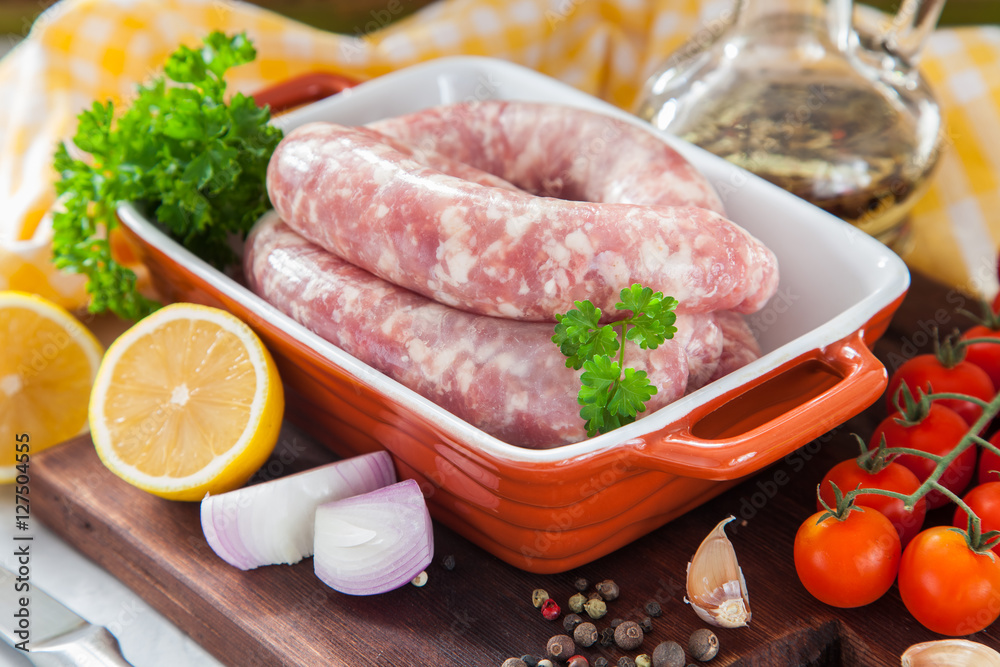 meat sausages for a grill in ware on a table, selective focus