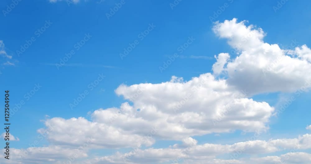 Beautiful white clouds soar across the screen in time lapse Beautiful white clouds soar across the screen in time lapse