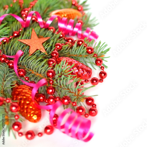Christmas tree branch with Christmas ornaments background