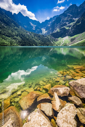 Wonderful pond in the mountains at sunrise in summer