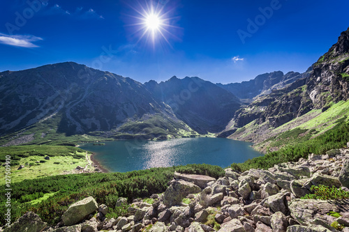 Fototapeta Naklejka Na Ścianę i Meble -  Breathtaking sunrise over Czarny Staw Gasienicowy in summer, Tatras
