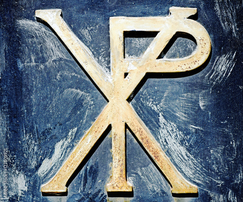 Chi-rho symbol on an ancient door in a cemetery photo