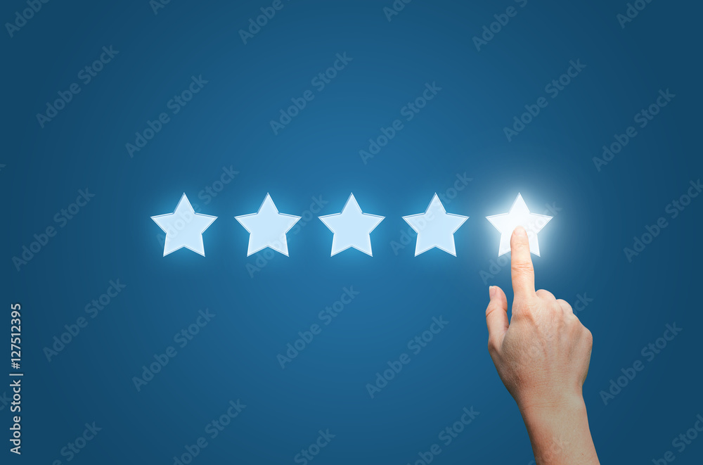 Businesswoman pointing five star to increase - obrazy, fototapety, plakaty 