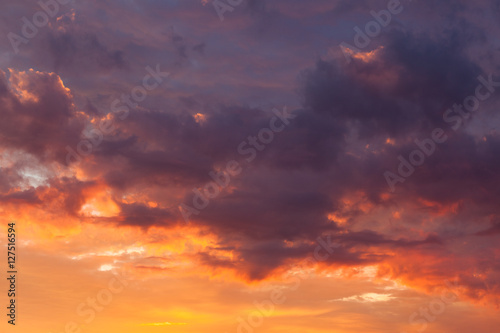 Fototapeta Naklejka Na Ścianę i Meble -  Fiery vivid sunset sky clouds