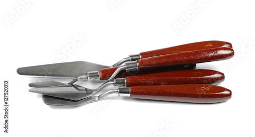 painting tools, metal spatula and brush isolated on white photo