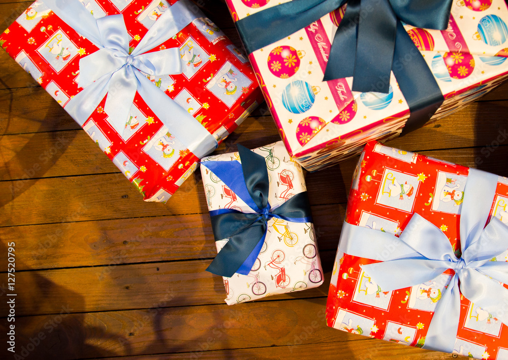 Christmas gifts are a lot on wooden background, top view, Christmas gifts. gift for holiday, birthday, anniversary Christmas gifts are a lot on wooden background, top view, Christmas gifts. gift for holiday, birthday, anniversary