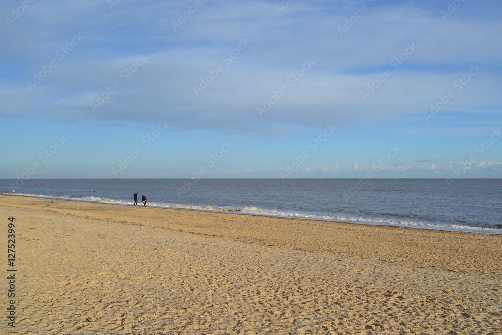 people on the beach in the distance people on the beach in the distance