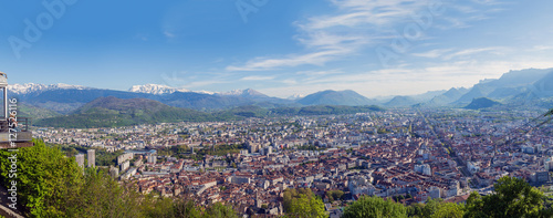 View of the City of Grenoble and the Alps from the observation deck fanikular. Panorama with dramatic city and the snow-capped Alps, the 4 frames.
