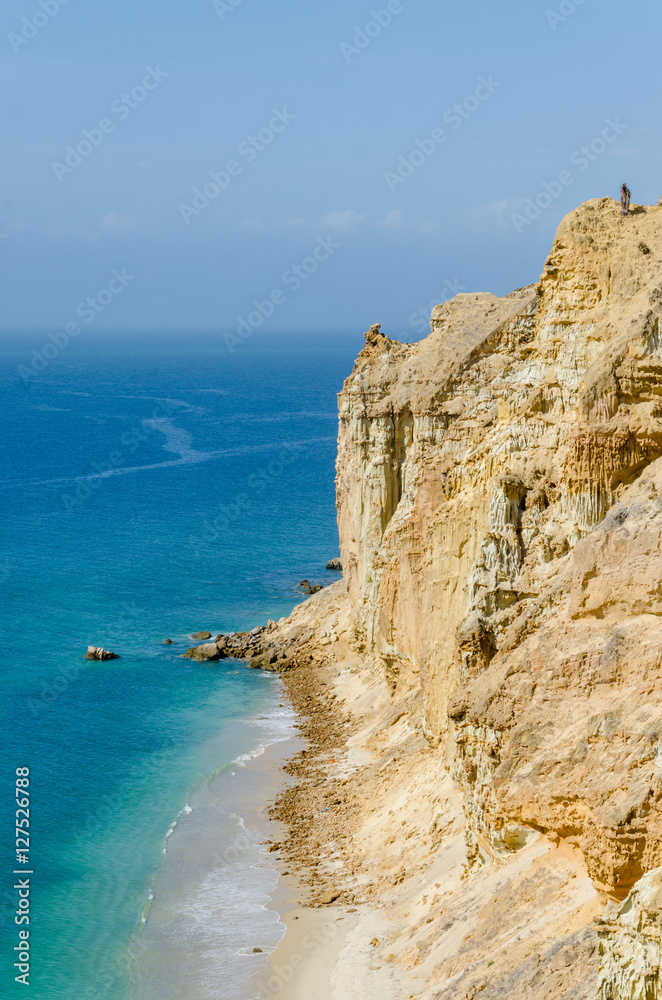 Fototapeta premium Impressive cliffs with turquoise ocean at the coast at Caotinha, Angola