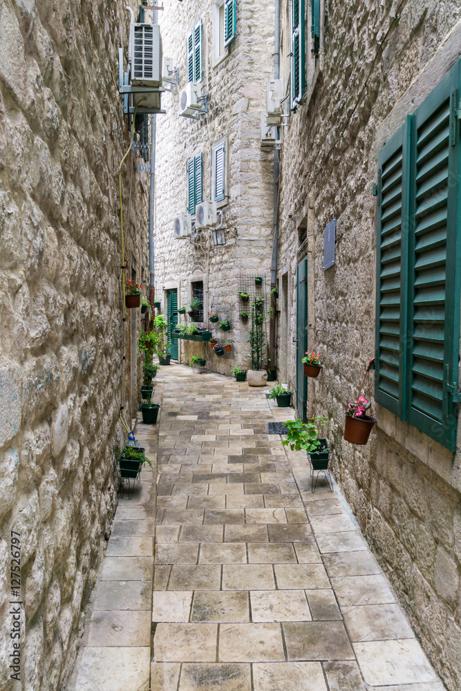 A typical looking narrow lane way in the medieval old town in Kotor in Montenegro, one of the hottest travel destinations of the year.