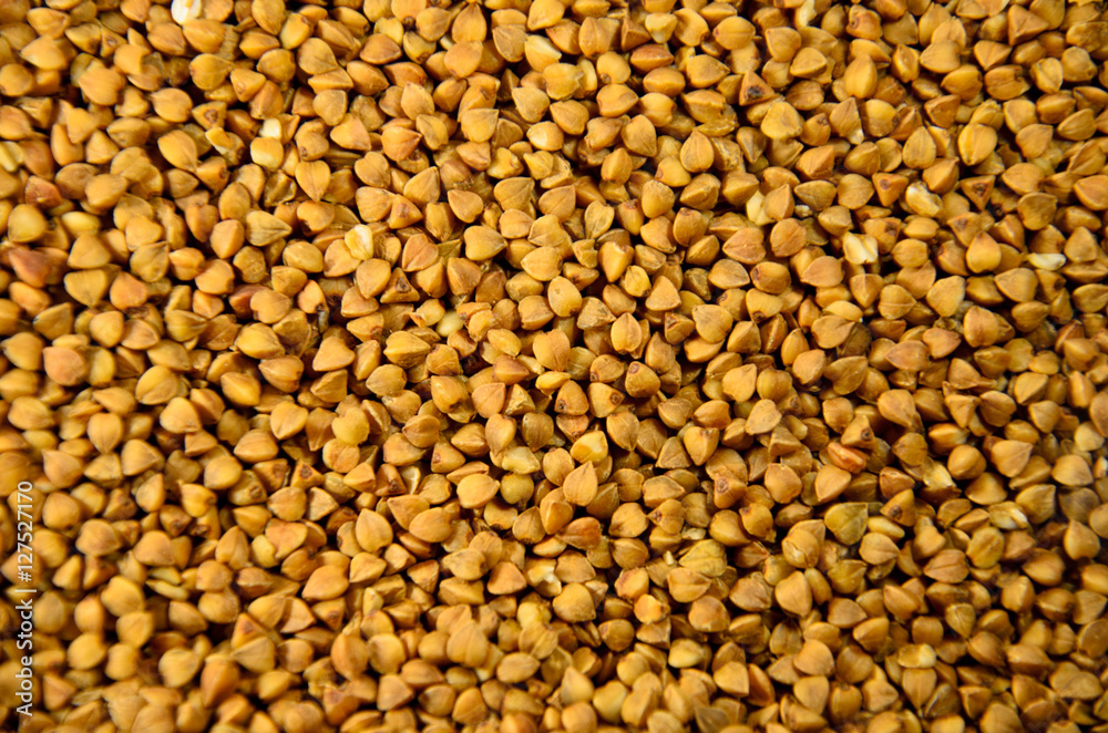 Background of the raw buckwheat. Vegan food Background of the raw buckwheat. Vegan food
