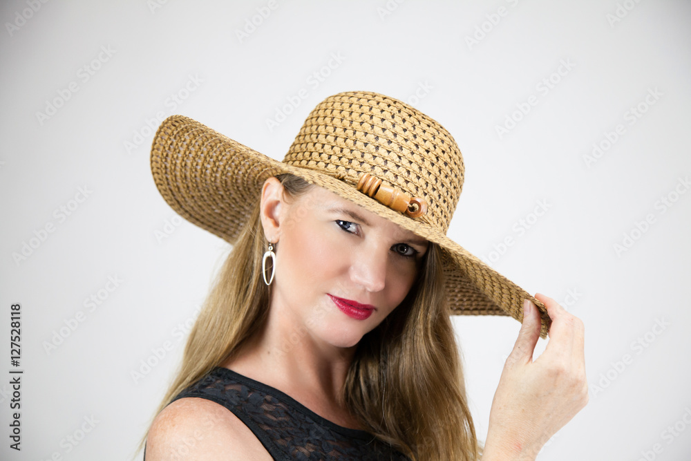 Blonde Female Holding Tip of Hat