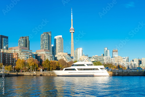 Toronto's skyline with CN Tower over lake. Urban architecture -