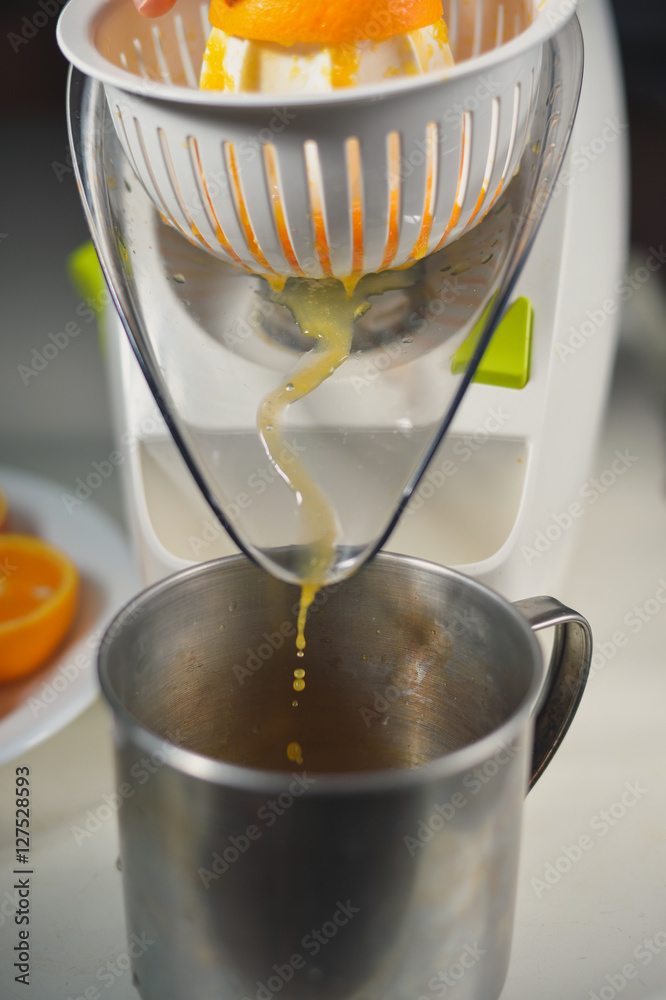 Closeup on squeezing healthy orange juice mix Closeup on squeezing healthy orange juice mix