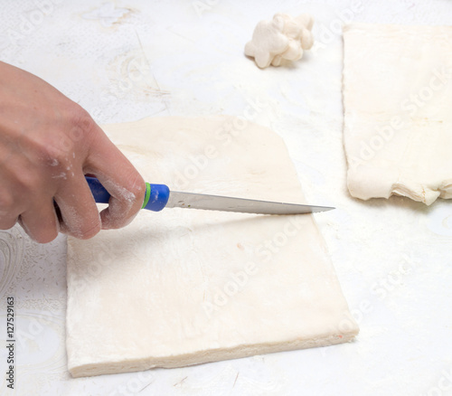 cutting the dough in the kitchen