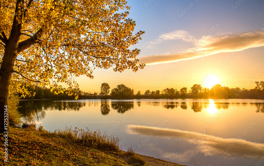 Romantic autumn sunset on the lake
