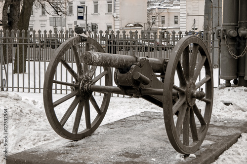 One of the ten old cannon imitations surrounding Glory Column in square in front of Holy Trinity Cathedral St Petersburg Russia photo