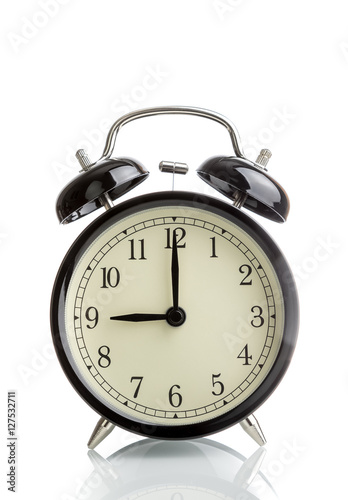 it's nine o'clock already, time to wake up for breakfast, vintage old black metallic alarm clock