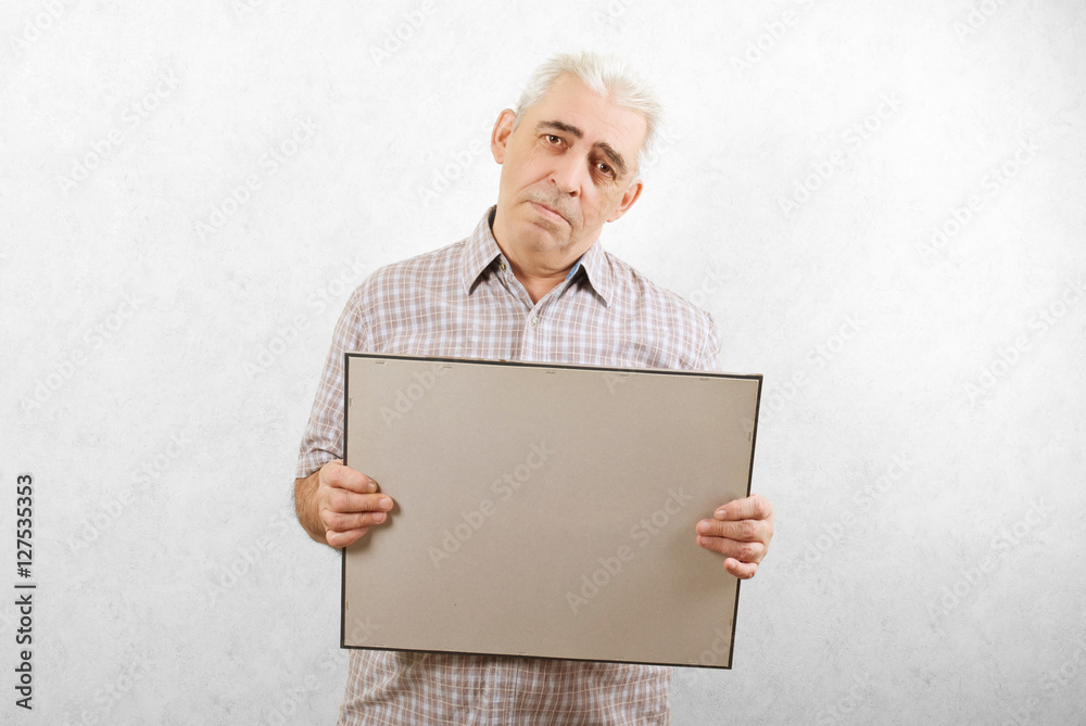 sad adult man with a cardboard in hand for the announcement