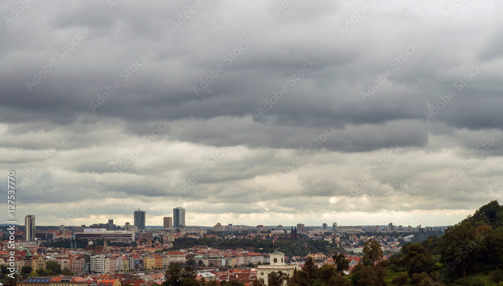 Cloudy nasty day in Prague. Red roofs in the city Prague