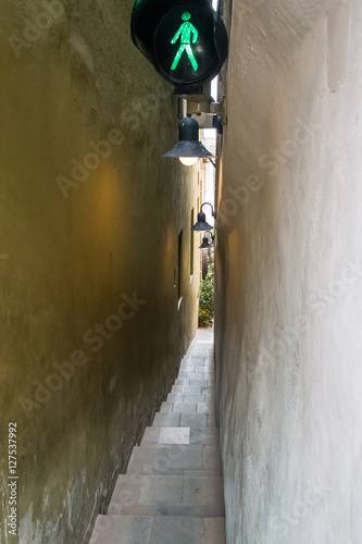 Photography Narrowest street with traffic light in Prague
