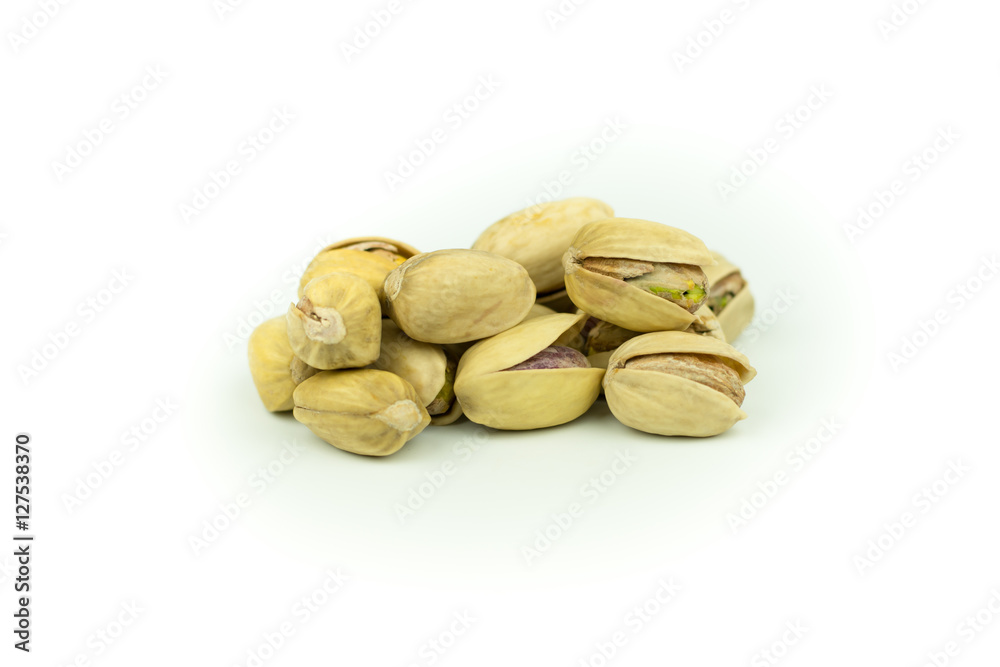 Pistachio nuts. Isolated on a white background. Pistachio nuts. Isolated on a white background.