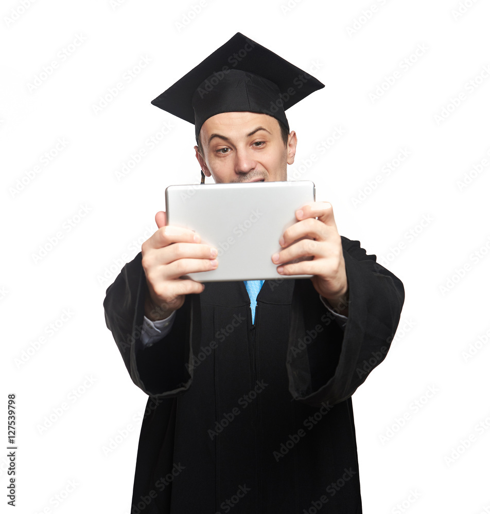 Graduated student look at tablet Graduated student look at tablet