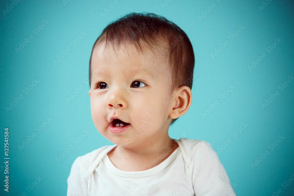 Newborn smiling, studio shot (soft focus on the eyes) Newborn smiling, studio shot (soft focus on the eyes)