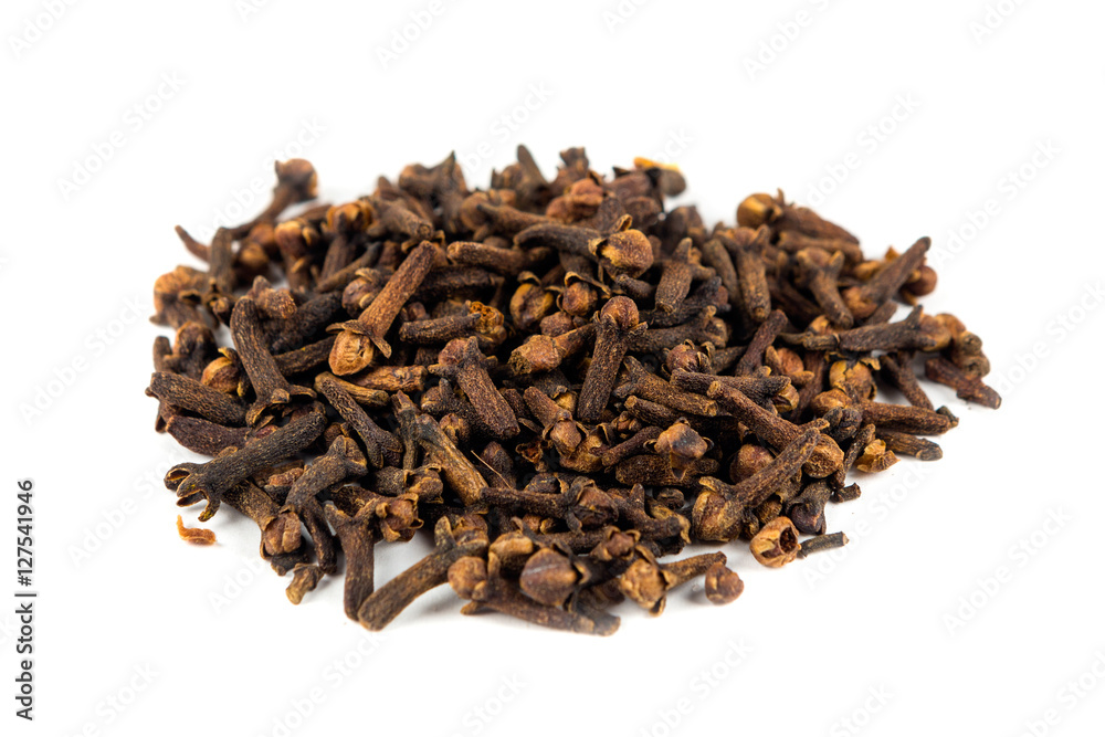 Pile of whole cloves isolated on white background