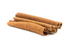 Stack of cinnamon sticks isolated on white background