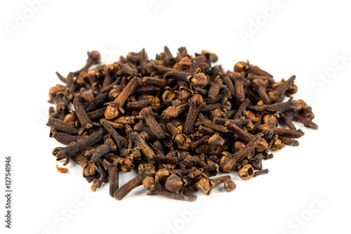 Pile of whole cloves isolated on white background