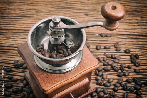 Vintage manual coffee grinder with coffee bean