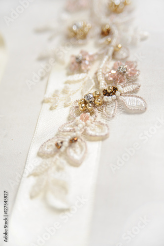 wedding background with rhinestone and bead embroidery