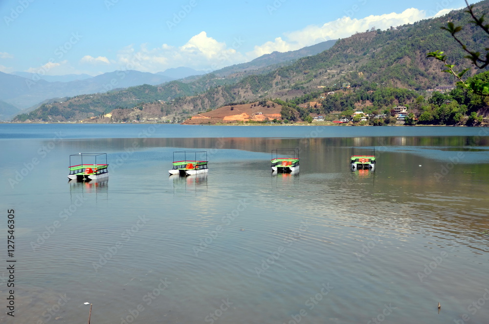 Four catamaran boats  on the Phewa lake  in Pokhara, Nepal