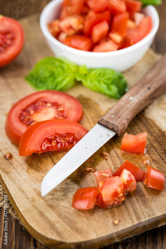 Cutted Tomatoes on vintage wooden background