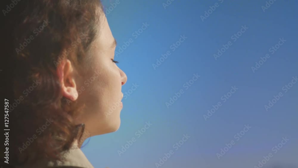 Woman breathing fresh air at sunset on the beach Woman breathing fresh air at sunset on the beach