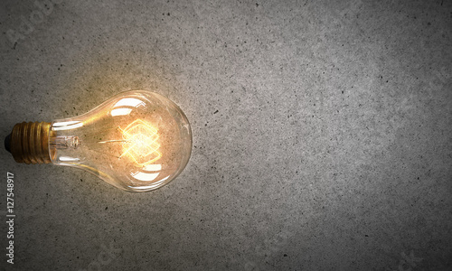 Electric bulb on texture . Mixed media
