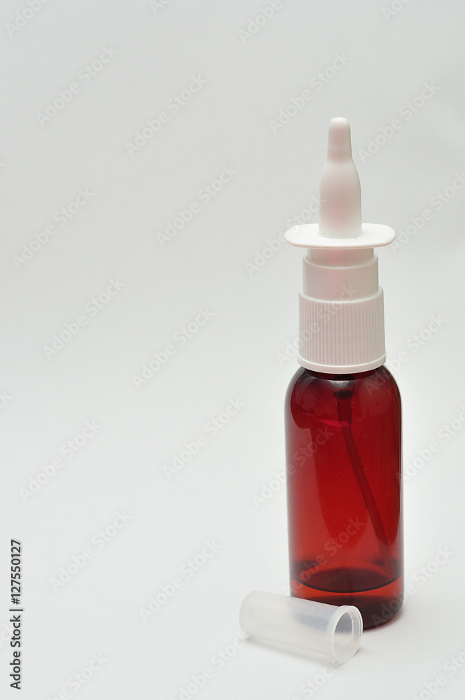 A nose spray bottle isolated on a white background A nose spray bottle isolated on a white background
