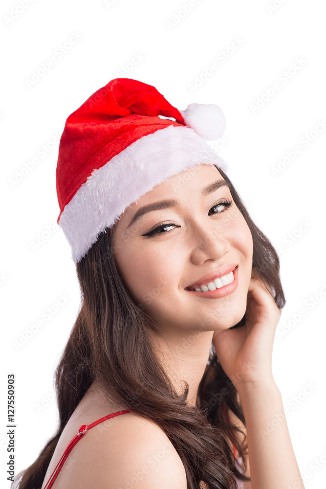 Christmas Woman. Beauty Asian Model Girl in Santa Hat isolated o Christmas Woman. Beauty Asian Model Girl in Santa Hat isolated o