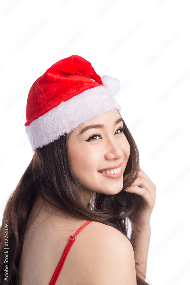Christmas Woman. Beauty Asian Model Girl in Santa Hat isolated o Christmas Woman. Beauty Asian Model Girl in Santa Hat isolated o
