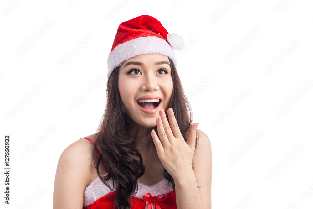Surprised christmas woman wearing a santa hat isolated on white Surprised christmas woman wearing a santa hat isolated on white