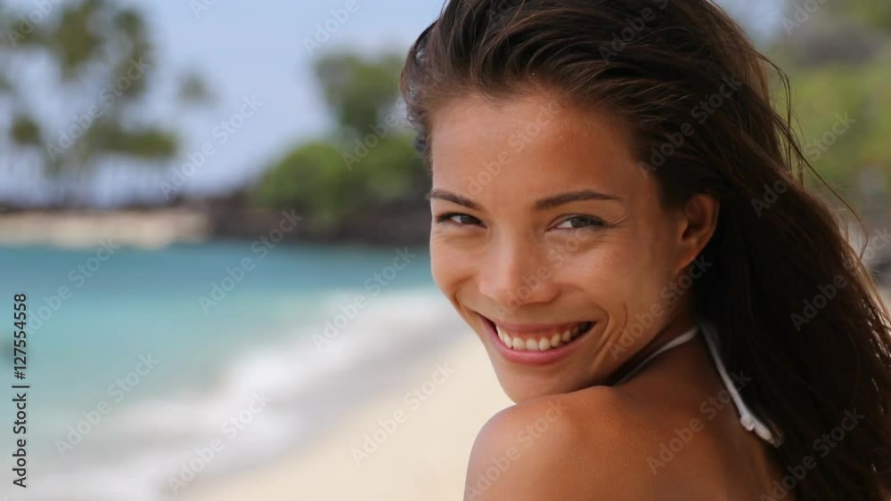 Beautiful serene asian beauty portrait of woman relaxing on tropical beach with turquoise ocean water background. Relaxation getaway in the sun, gorgeous chinese model in swimwear and healthy hair. Beautiful serene asian beauty portrait of woman relaxing on tropical beach with turquoise ocean water background. Relaxation getaway in the sun, gorgeous chinese model in swimwear and healthy hair.