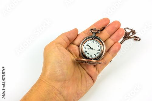 Woman hand holding a pocket watch on white background.