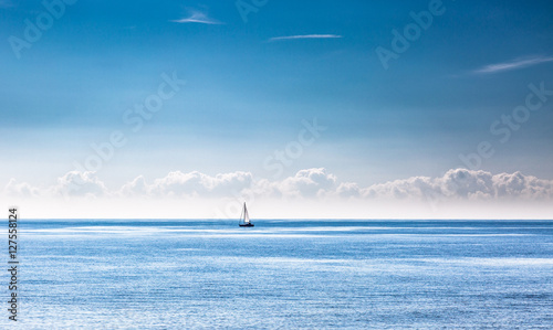 Lonely sailboat on calm sea