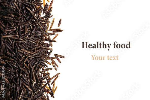 Border of black rice close-up  on white background. Isolated. Decorative frame of wild brown unpolished rice.