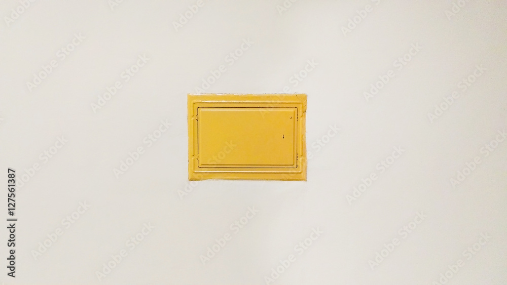 yellow cover of the fuse box is in the wall yellow cover of the fuse box is in the wall