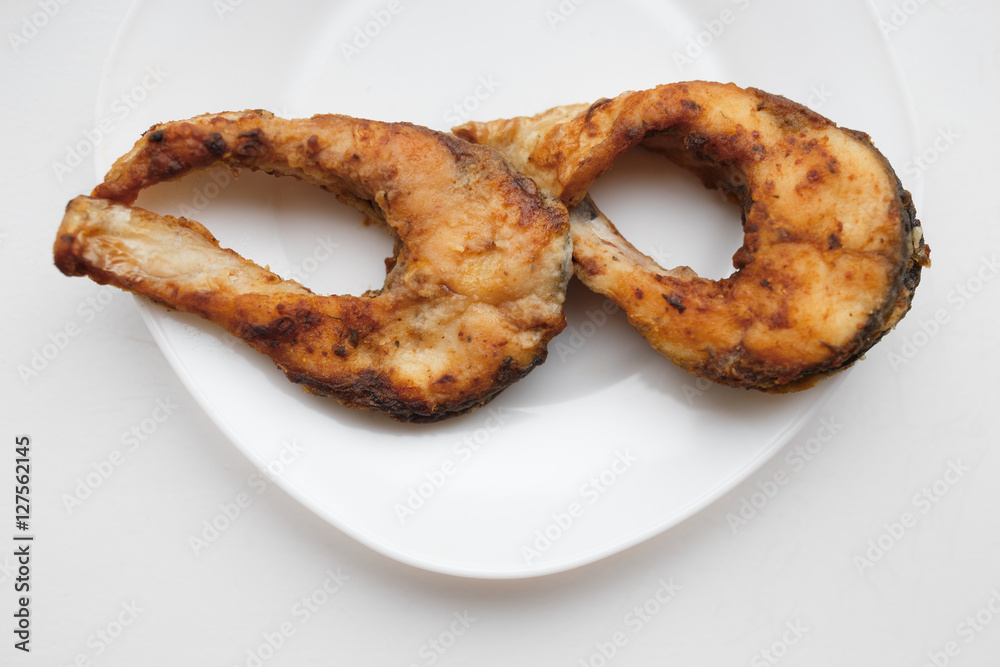 Fried  fish on a white background