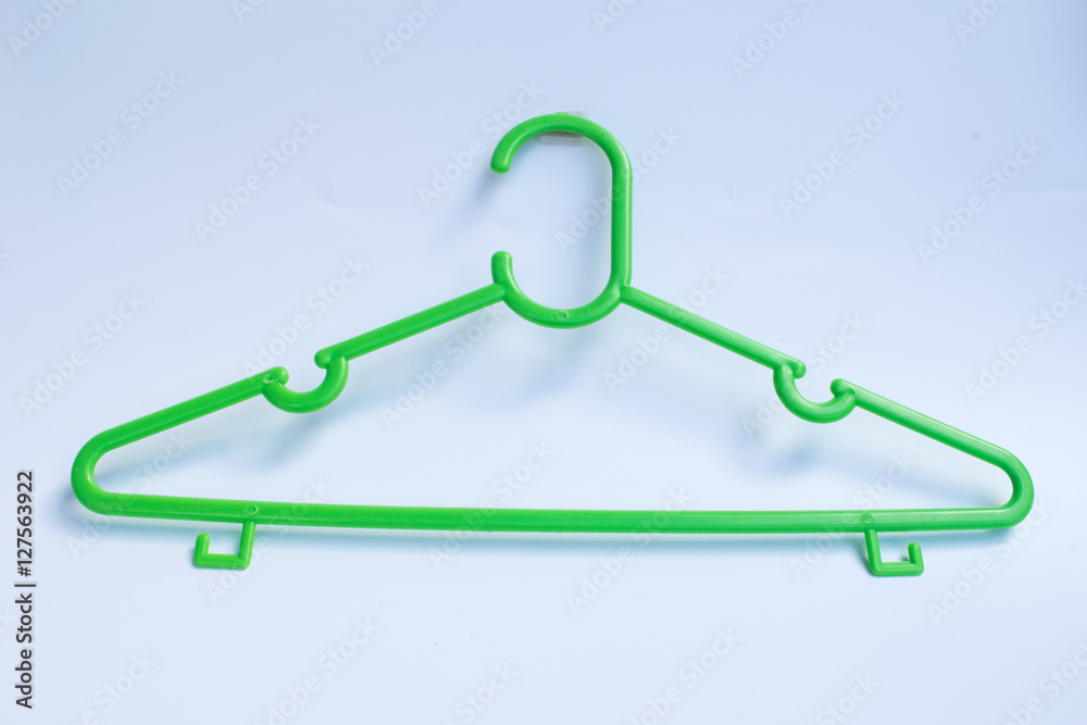 green plastic hanger on white background green plastic hanger on white background