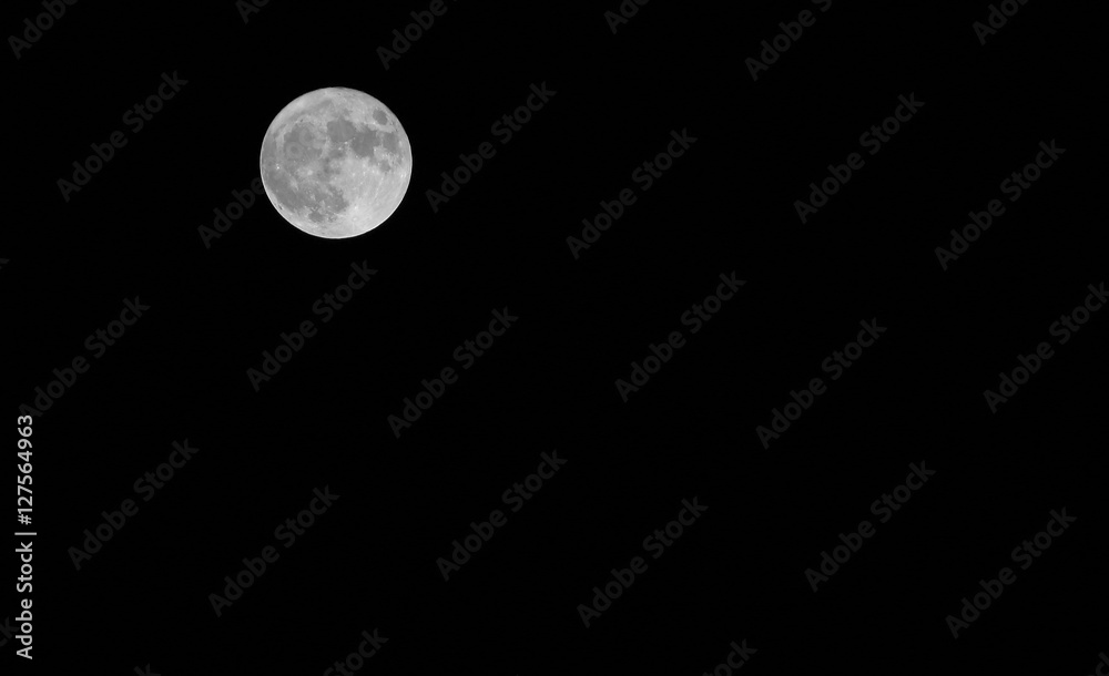 full moon in the dark sky on a night in late autumn full moon in the dark sky on a night in late autumn